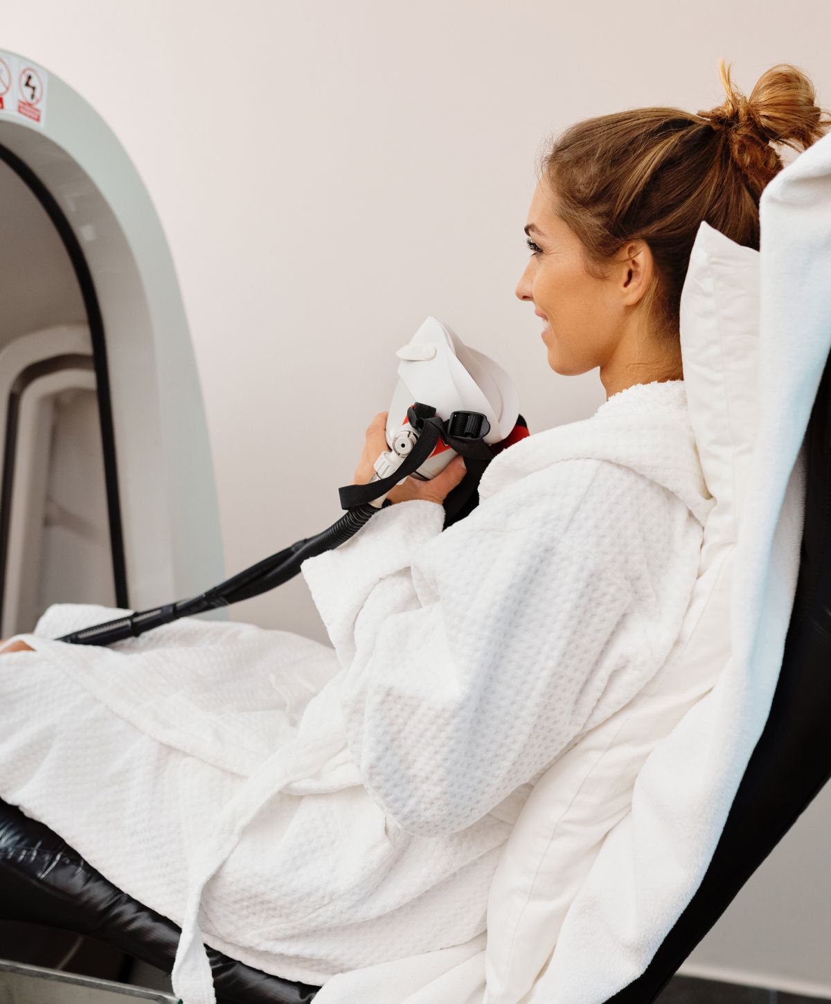 Woman in robe ready for treatment session.
